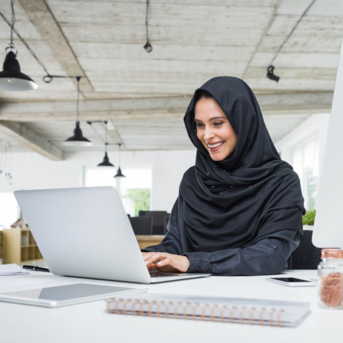 Muslim Business Woman Working on Laptop